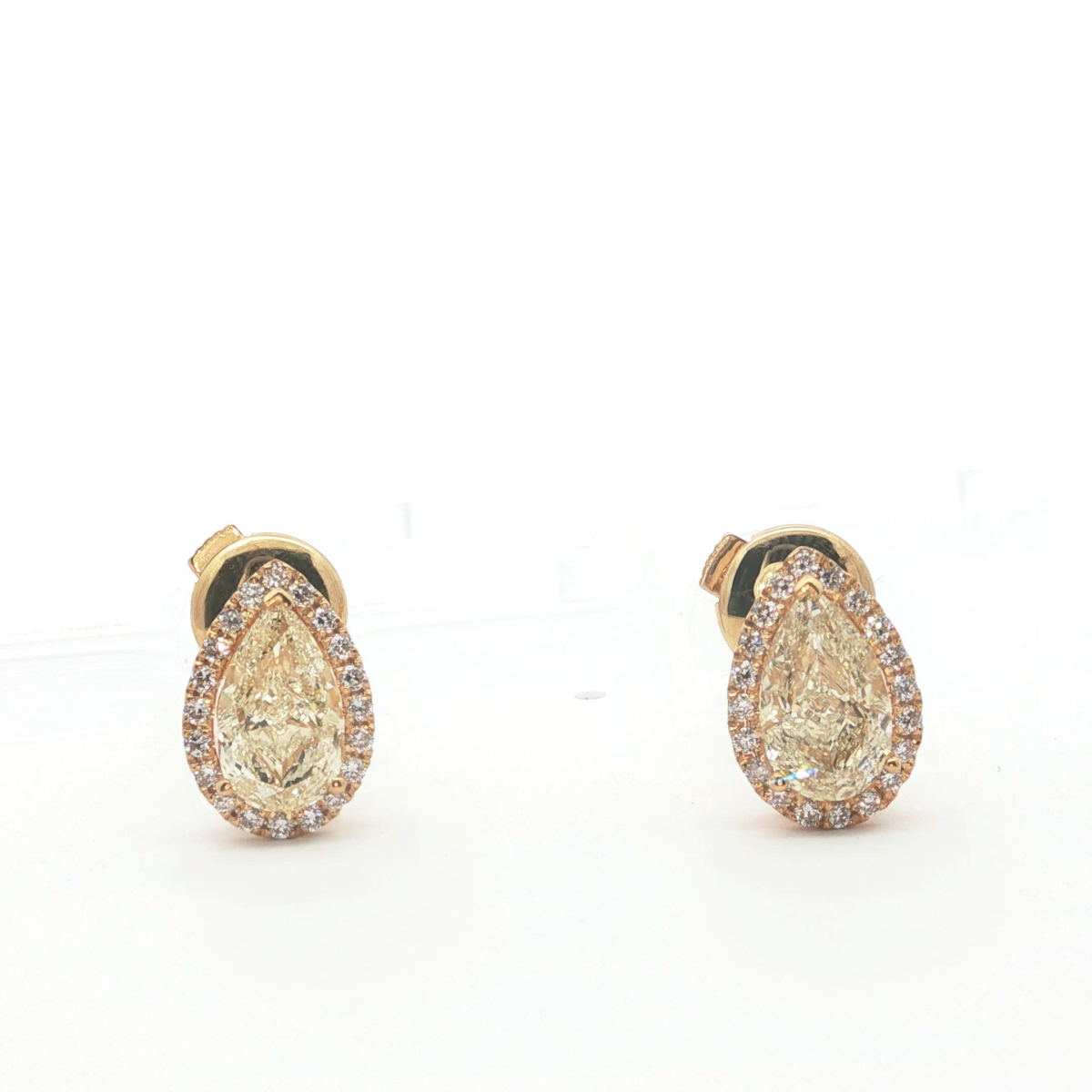 Fancy Yellow Pear Cut Diamonds Stud Earrings