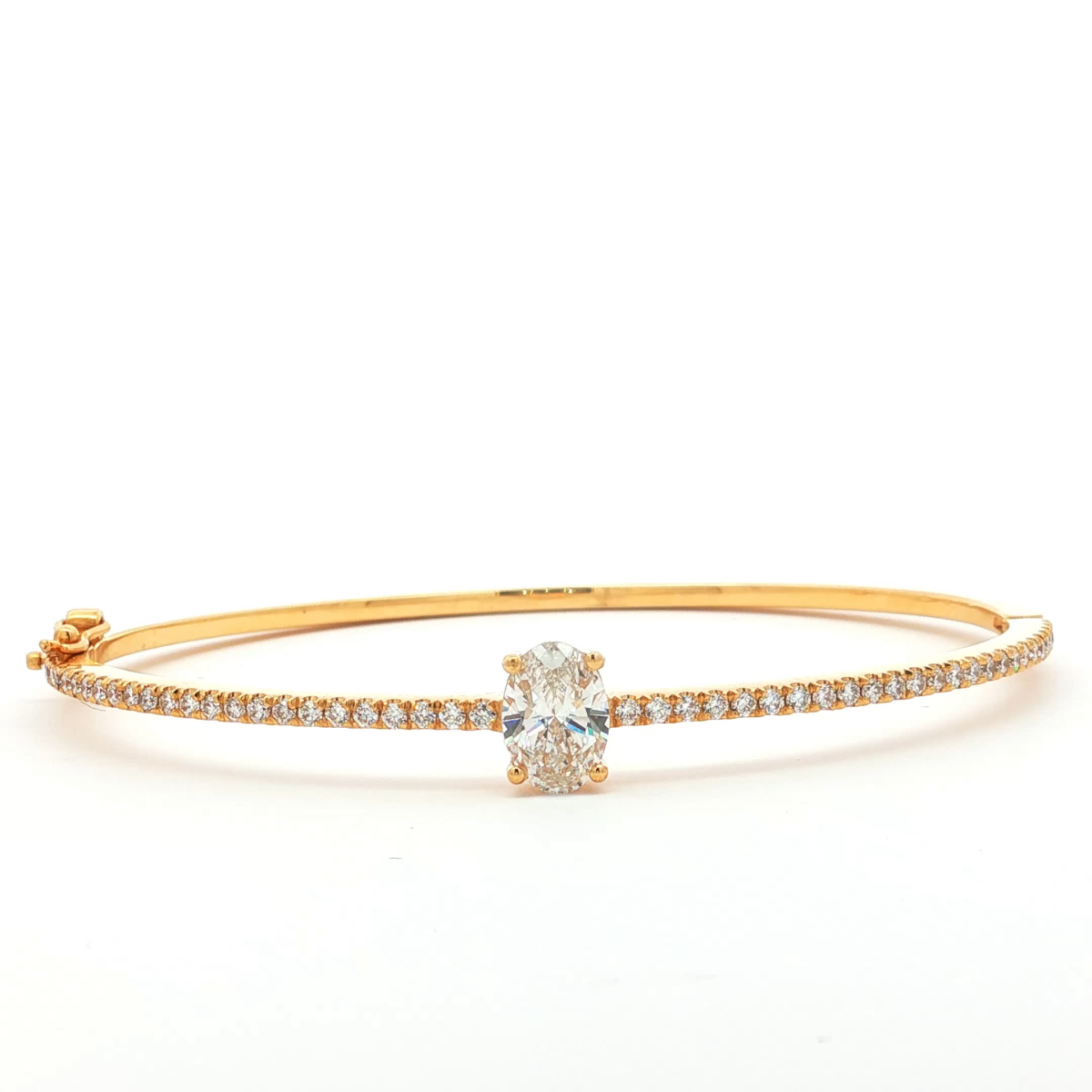 Oval Cut Diamond Bangle in Yellow Gold