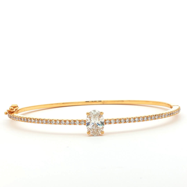 Oval Cut Diamond Bangle in Yellow Gold