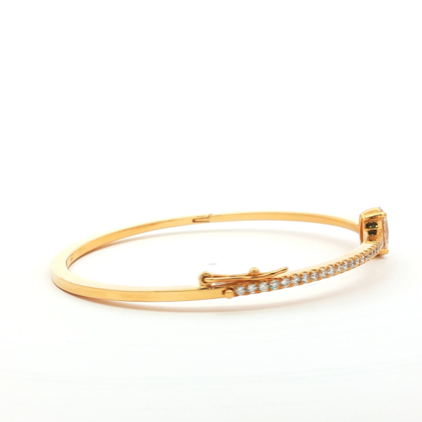 Oval Cut Diamond Bangle in Yellow Gold
