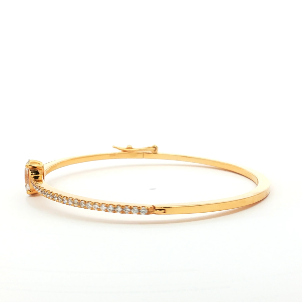 Oval Cut Diamond Bangle in Yellow Gold